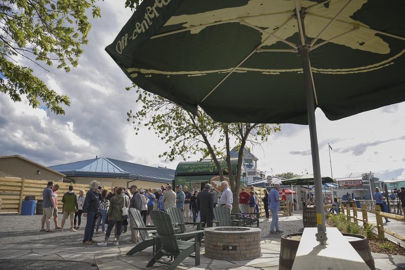 Off-Centered On The Rocks has a fire pit, food truck a large gravel patio with cornhole and other games.